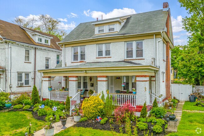 Single-family colonial homes in Trenton's West End often feature large covered front porches.