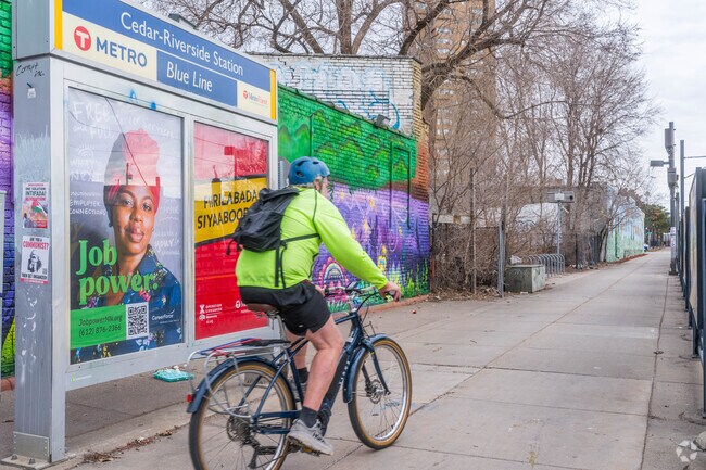 A cyclist makes their way on the greenway in the Cedar-Riverside neighborhood.
