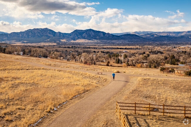 Davidson Mesa Trail offers breathtaking views and a serene escape, seamlessly connecting outdoor enthusiasts to Louisville, Colorado, with easy access to the city's parks, paths, and vibrant community life.