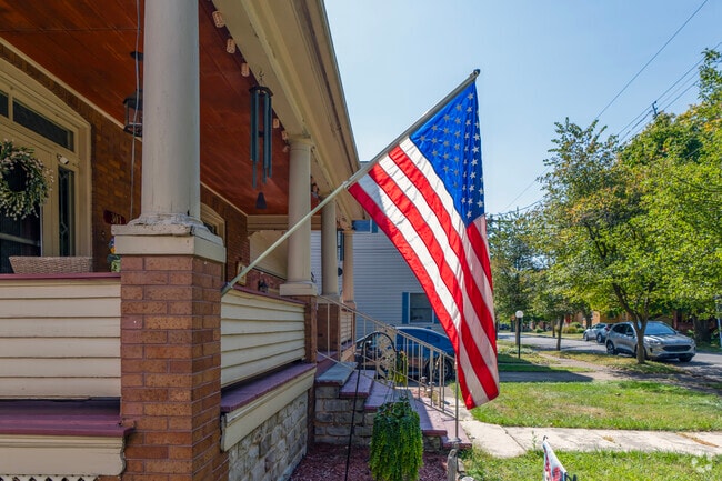 Highland Park residents decorate their homes with flags and wreaths.
