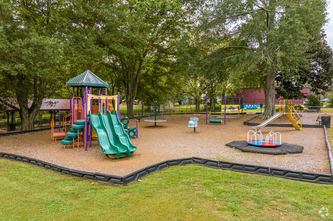 Experience a variety of exciting new playground structures at Roy E. Parks Playground, designed for both fun and safety, where children can climb and slide in downtown Auburn.