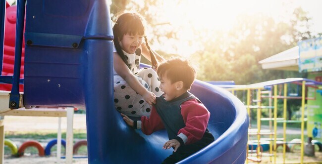 Kids playing on a slide