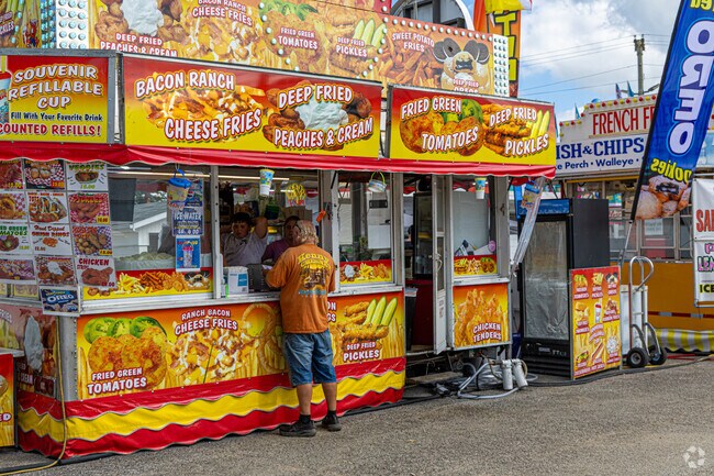 Wellington’s Lorain County Fair served deep-fried peaches and cream, cheesy fries, pickles, and featured refillable souvenir cups as part of the classic fair experience.