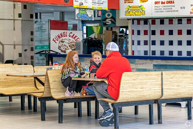 Casual boardwalk eats and family laughter are always on the menu in at Three Brothers From Italy Pizza in Seaside Heights, NJ.