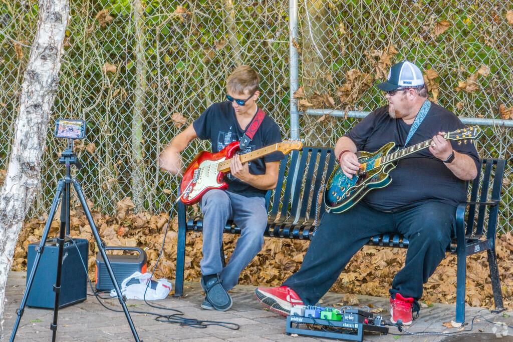 Residents jam out on their guitars at Etowah River Park.