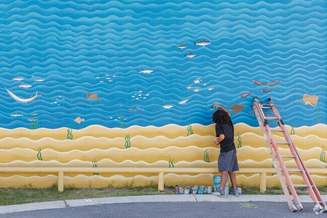 Discover beach murals drawn by local artists near Azalea Acres.
