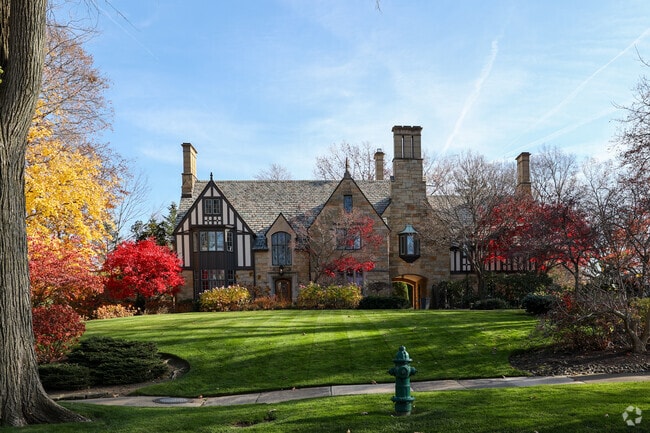 A large English Tudor style home overlooks a well maintained lawn, in Shaker Heights.