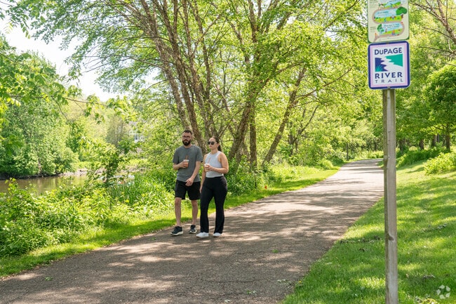 Hobson Village residents enjoy a walk along the DuPage Riverfront Trails in Naperville, IL.