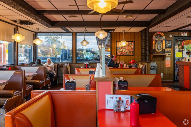 The Rootbeer Stand is a casual eatery with drive-in service featuring homemade root beer.