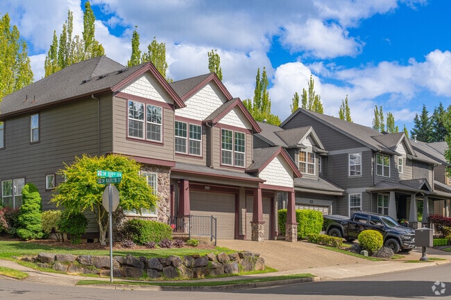 Large McMansions with Craftsman facades are popular in the Tualatin neighborhood.