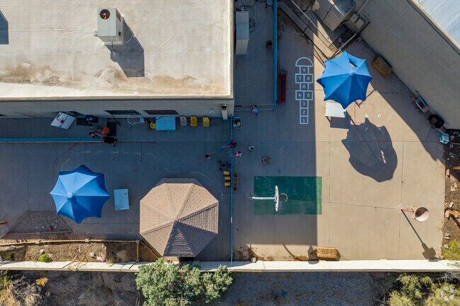 Kids grab a round of hopscotch at Phoenix’s Amici Trilingual Montessori.