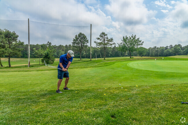 A golfer practices his chip at the Cranberry Valley Golf Course in Harwich Center.