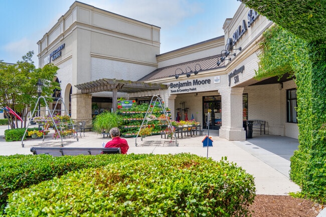 The Benjamin Moore store anchors a landscaped retail plaza in Stonehenge East.