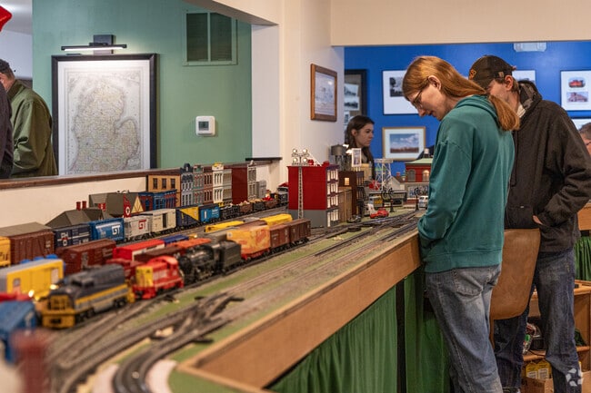 Wolf Lake folks view model trains at Muskegon Railroad Historical Society Holiday Open House.