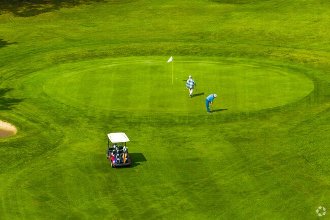 Players enjoy a sunny day on the fairways at Caledonia’s golf course.