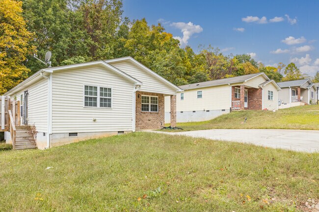 Single-level cottages are nestled on a hillside in Weston.