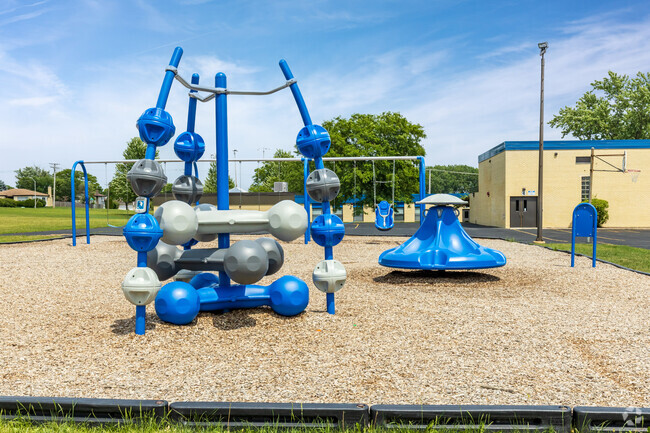 The playground at the school's grounds is in schools colors of grey and blue.