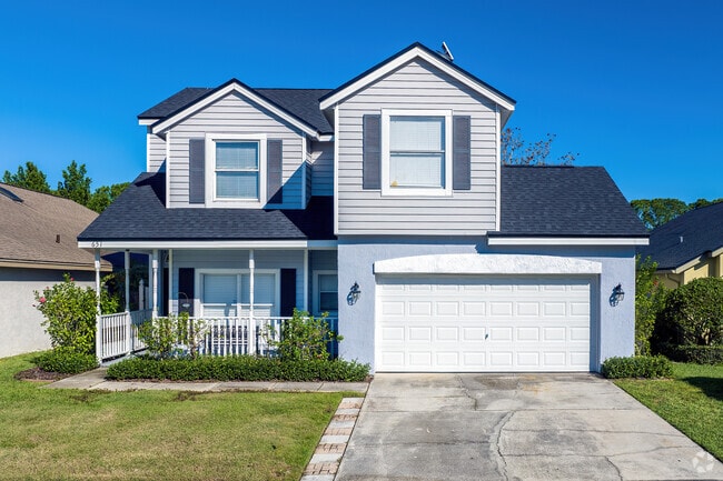 This two-story Greenwood Lakes home features a beautiful covered front porch.