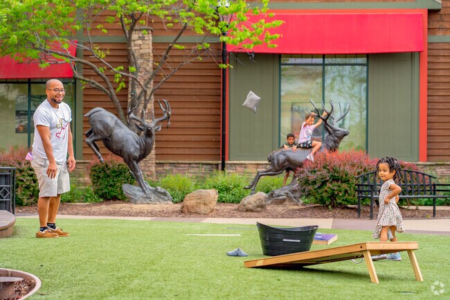 Families gather and enjoy the weather at the Fountains play area in Harding Roseville.