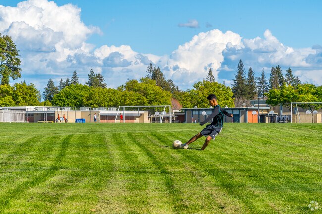 Students play soccer at Dave Roberts Community Park after school.