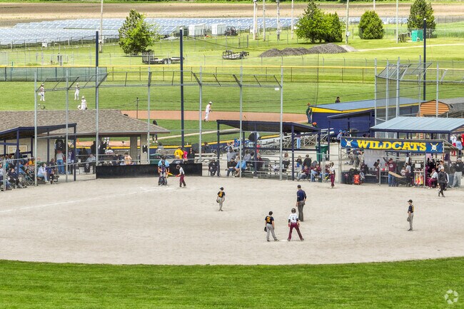 The residents of Woodville play local baseball games at the vast Freedom Field complex.