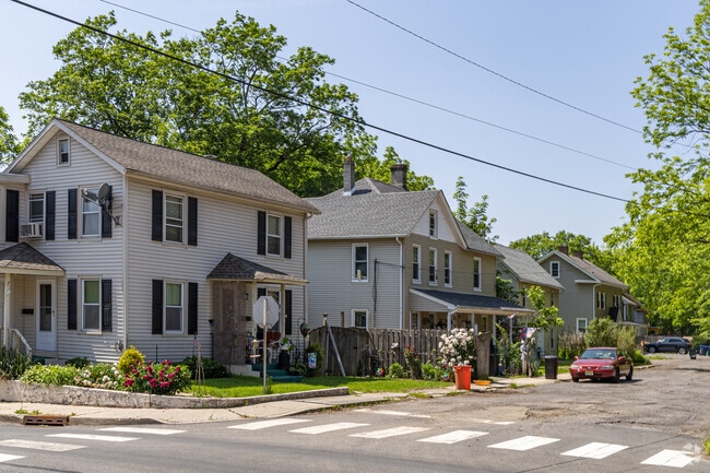 The presence of mature trees and well-maintained gardens enhances the curb appeal of these timeless residences in High Bridge.