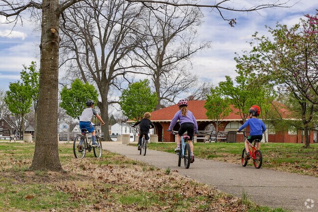 Smoketown kids ride their bikes in Shelby Park.