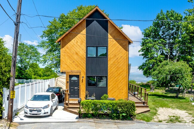 Some Germantown residents optimize their location by building modern homes with water views.