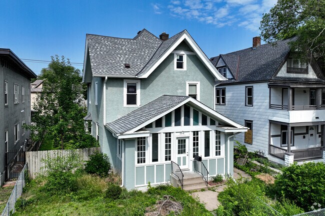 Two-story homes in Powderhorn Park often have cross-gabled roof design.