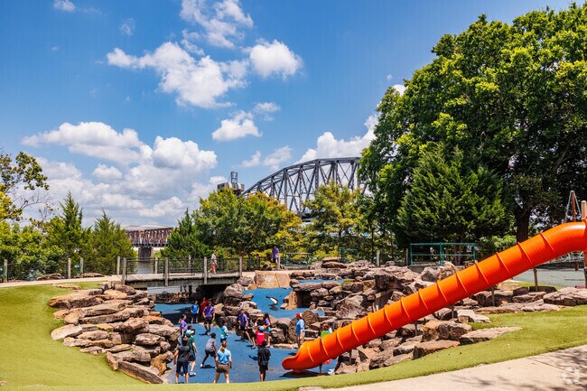 Children enjoy the Tunnels Playground at River Front Park.