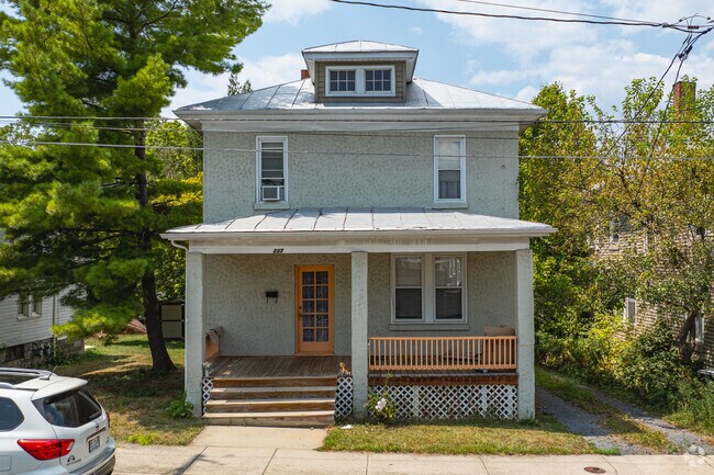 A quiet front porch on a classic Foursquare home is a great place to relax in Waterman.