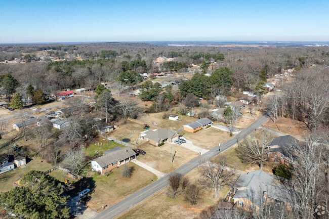 Trinity homes and planted among a forested landscape offering a quiet rural environment.