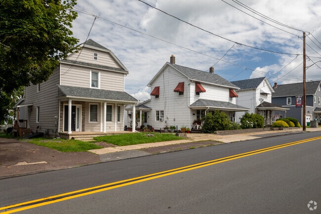 Wide streets and diverse home styles create a welcoming neighborhood in Jessup, PA.