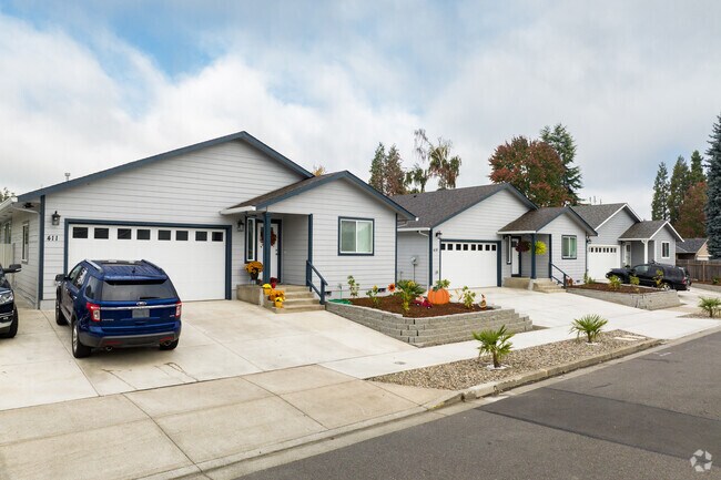 Minimal modern homes appear alongside classic ranch styles in Four Corners.