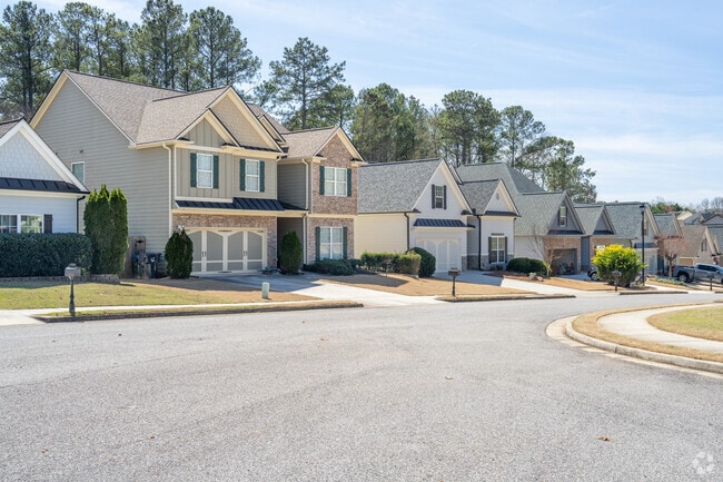 Homes in Sugar Hill sit on wide streets with shallow front lawns.
