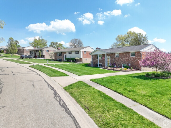 Old and new homes are within the  winding curves and hills of White Oak West.