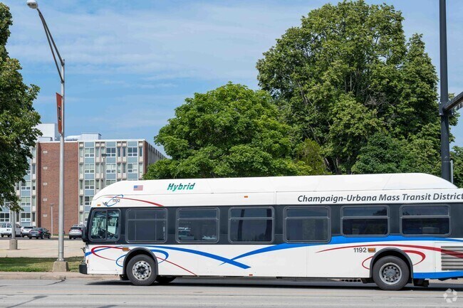 MTD bus traveling through a Champaign neighborhood near Boulder Ridge area.