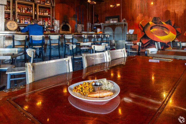 Cozy up to a well cooked meal at eMbers Station Bistro & Bar, which features a woodfired oven.