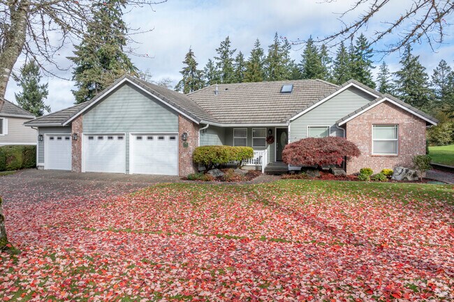 Stunning craftsmen style brick home with fall colors in the Lacey WA area.