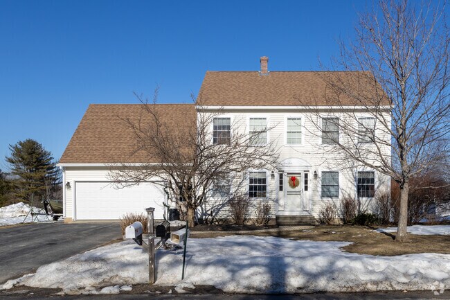 This modern Colonial style home is nestled in Gorham