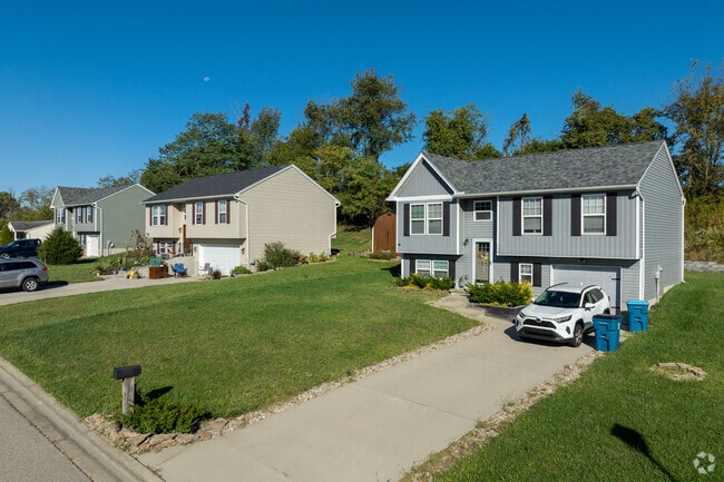 Dry Ridge offers scenic two-lane roads and gently rolling hills, with homes nestled near farmland and lakes.