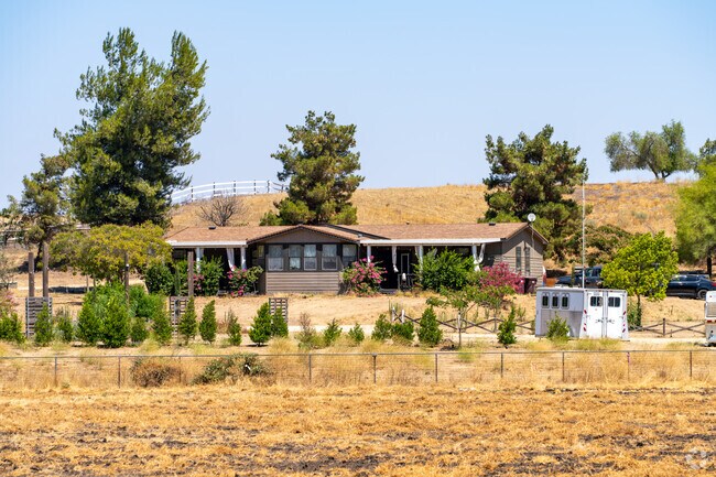 Ranch-style home in Sage with expansive acreage and rustic charm.