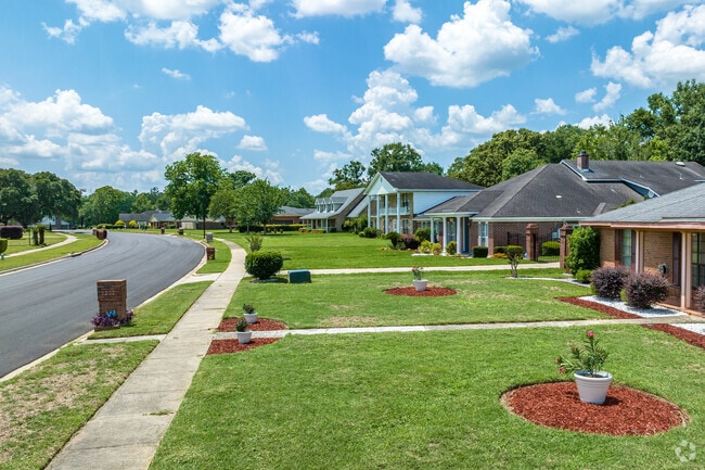 Canterbury awns are well-kept, and natural landscaping creates a seamless quality.