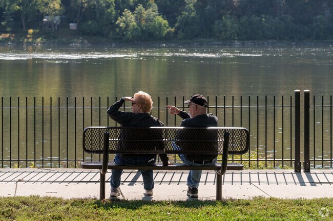 A couple sits along the peaceful Allegheny River in this Maytown park.