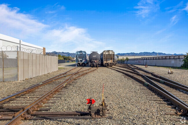 Parallel lives Railroad tracks carving through Iron Triangle.