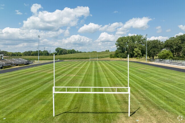 Harvard High School has a beautiful football field surrounded by a track.
