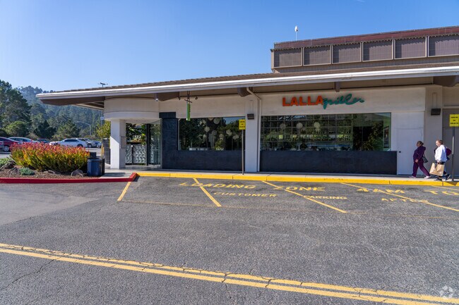 Grab a cocktail at Lalla Grill Del Monte in Skyline Forest and relax in the outdoor seating.