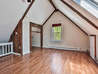 Loft living area with beams