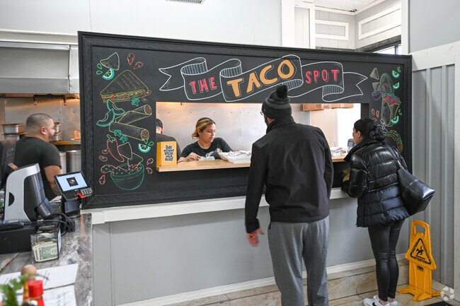 Customers wait for their order at The Taco Spot in Union Hill, Worcester.
