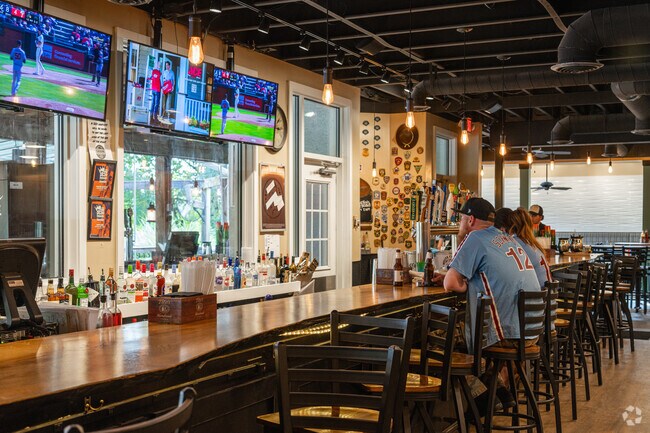 Enjoy a game with a friend at Grain H2O, which features a full bar in Kirkwood.